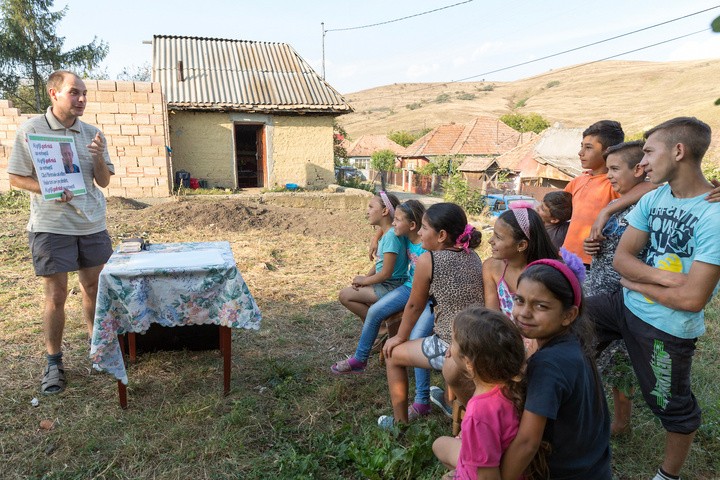 A Wycliffe member leads a kid's Bible club in a Rroma village in
Romania. Photo credit: Heather Pubol