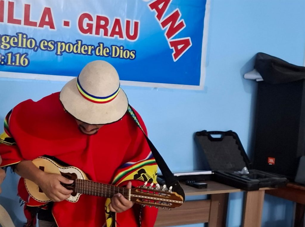 A man playing the Andean stringed instrument, the charango.